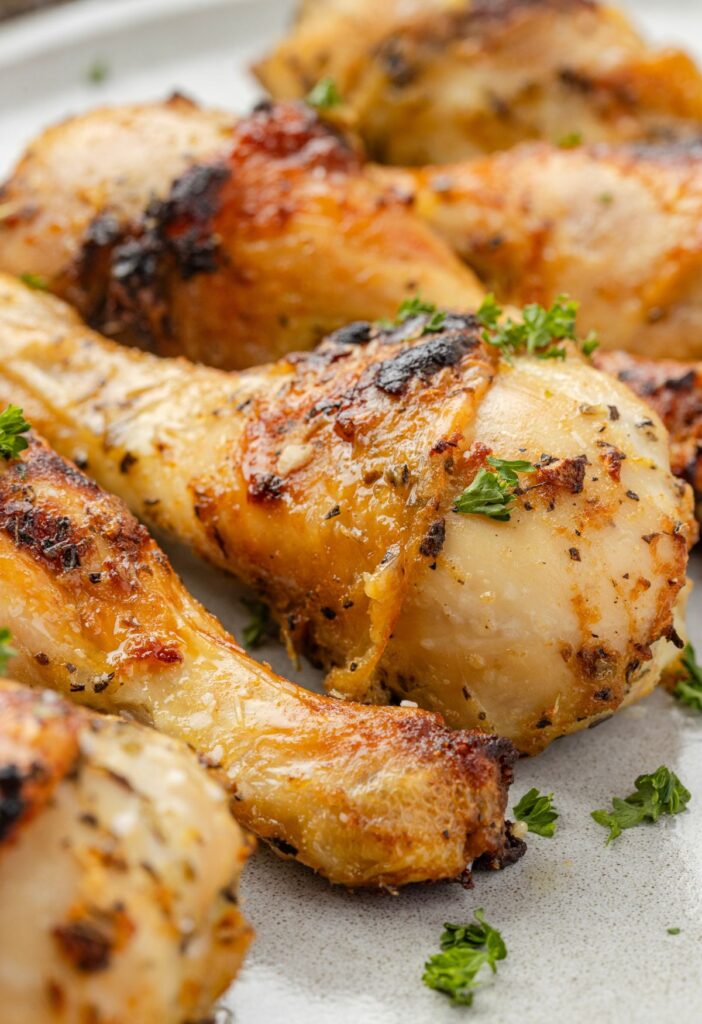 Oven baked chicken drumsticks ready to serve for dinner.