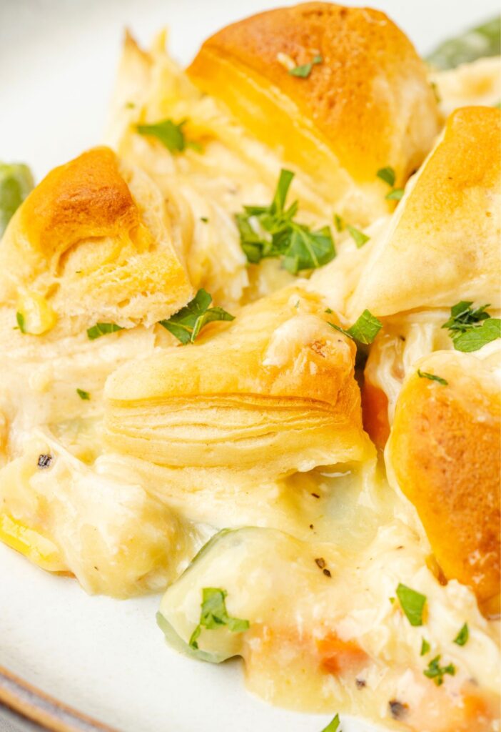 A serving on a white plate of the biscuit casserole