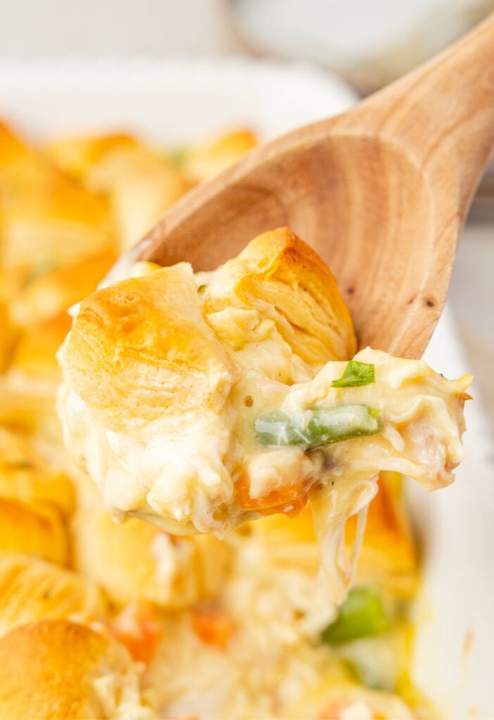 Some of the biscuit casserole on a wooden serving spoon to show it up close.