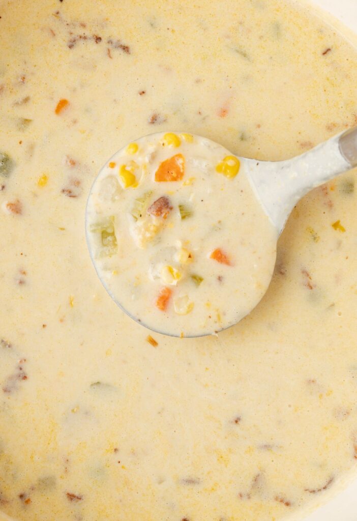 Close up image of the chowder recipe with a soup ladle/
