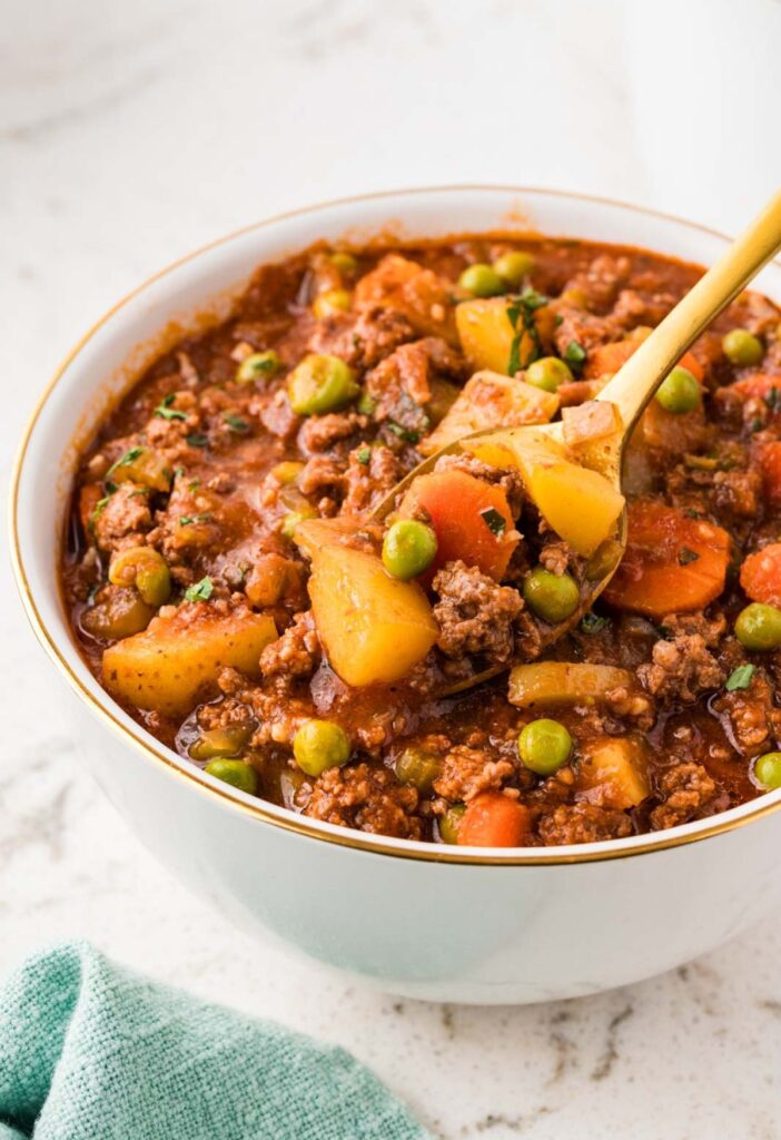A bowl of stew with a spoon