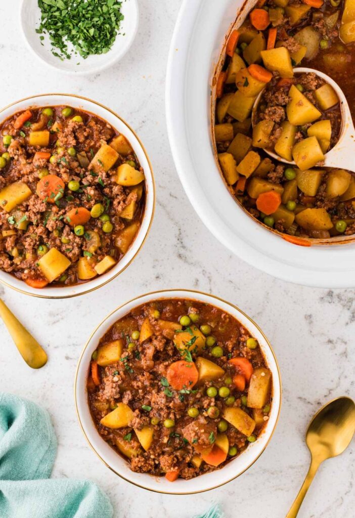 Overhead pic of the stew inside the slow cooker and in a serving bowl.