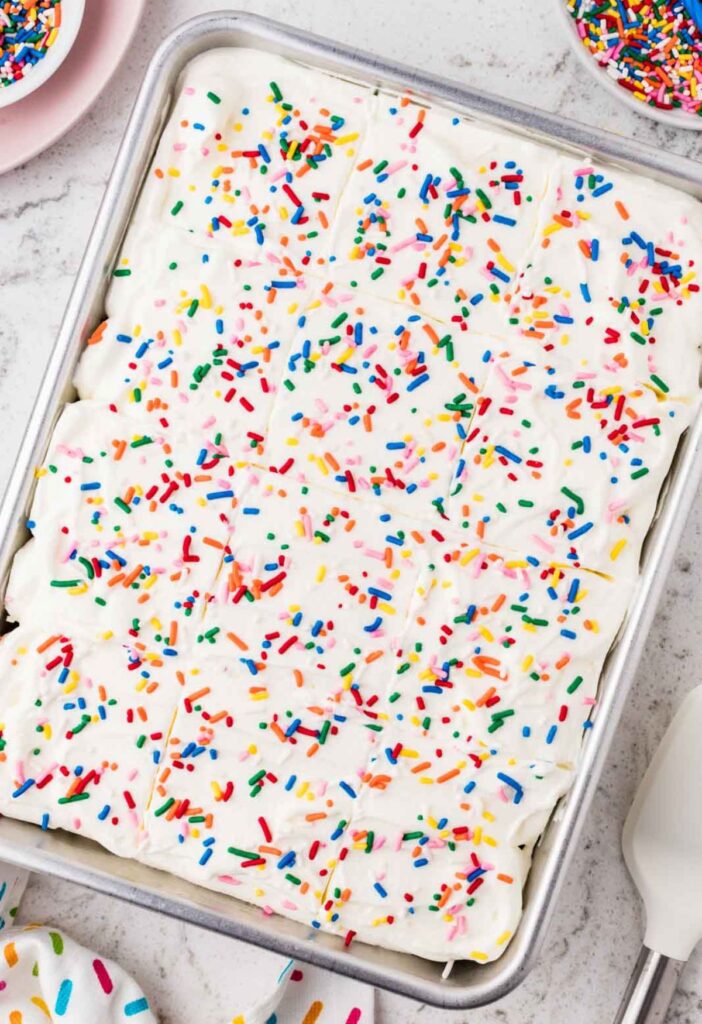 Funfetti poke cake inside the cake pan