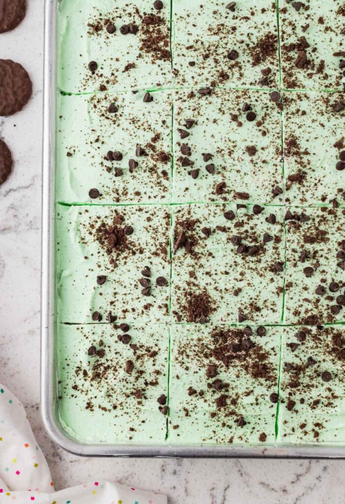 Top view of the cake with mint whipped cream on top.