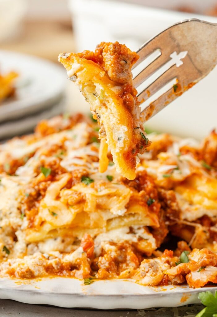 A fork with ravioli on it from the lasagna