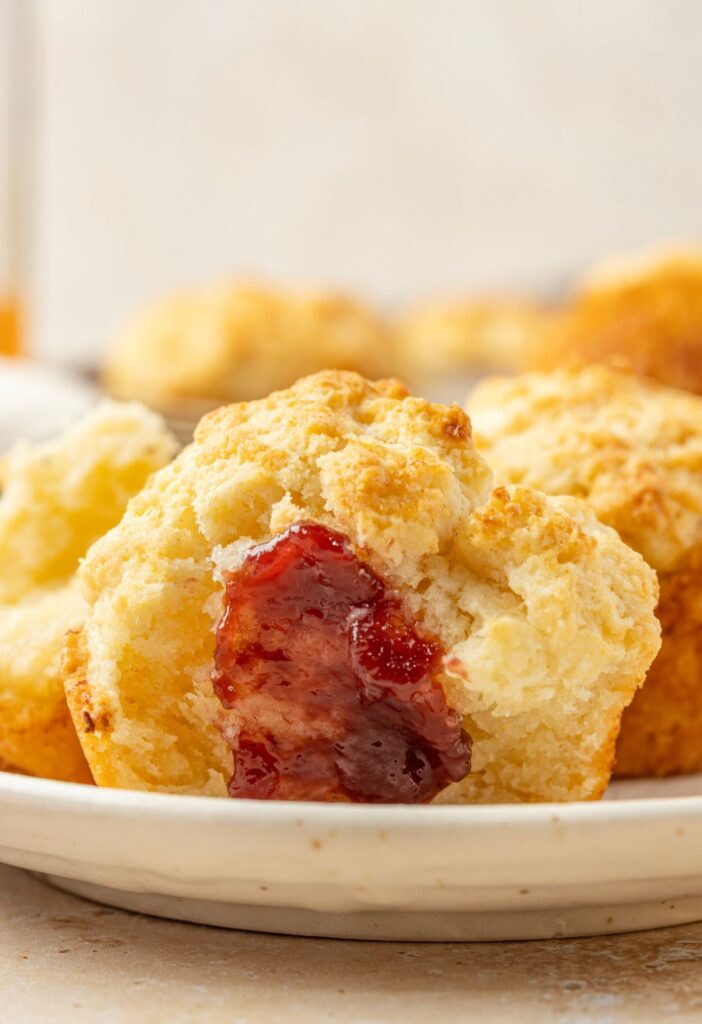 A biscuit with jam on it