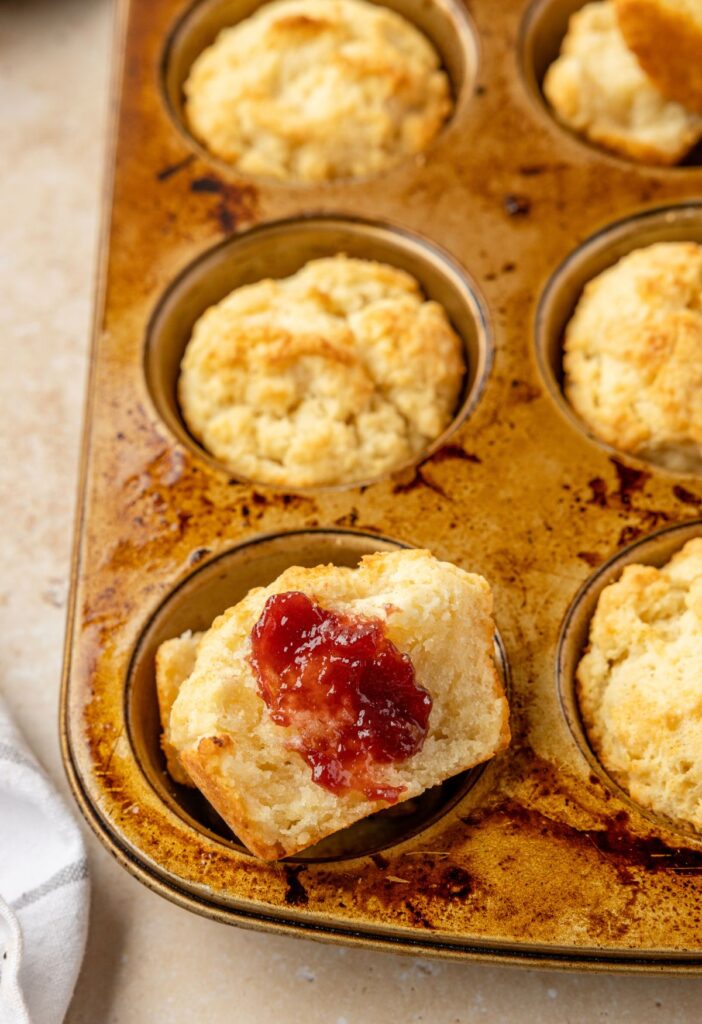 A muffin tin of sour cream biscuits