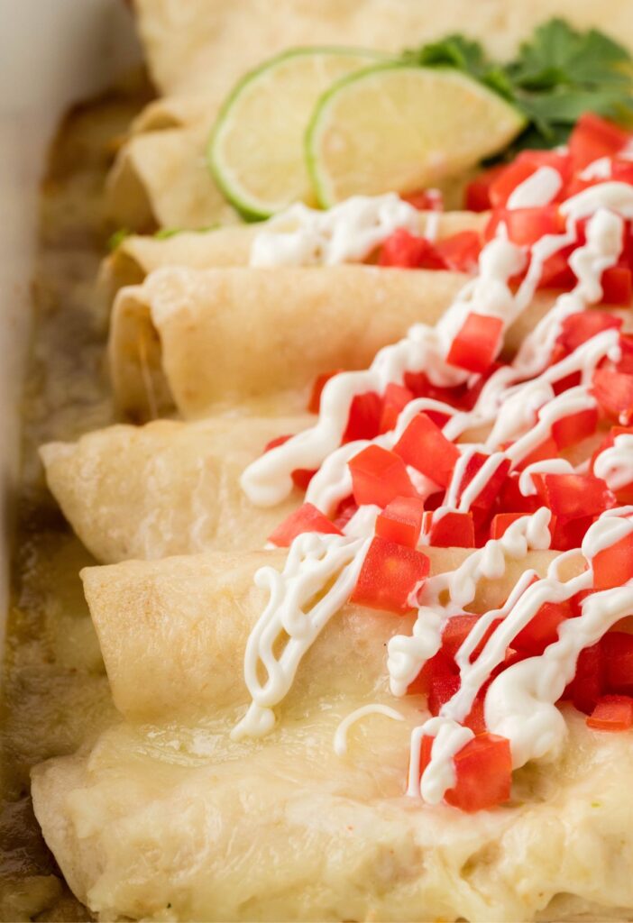 The pan of baked honey lime chicken enchiladas