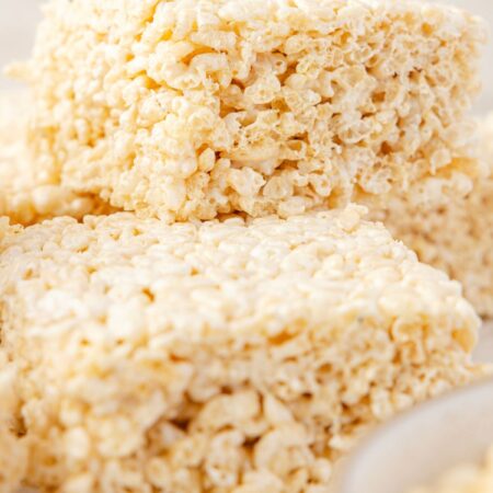 Rice Krispie treats with a bowl of marshmallow cream
