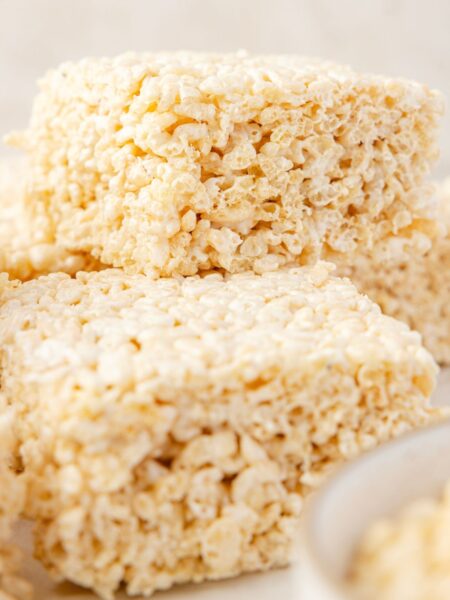 Rice Krispie treats with a bowl of marshmallow cream