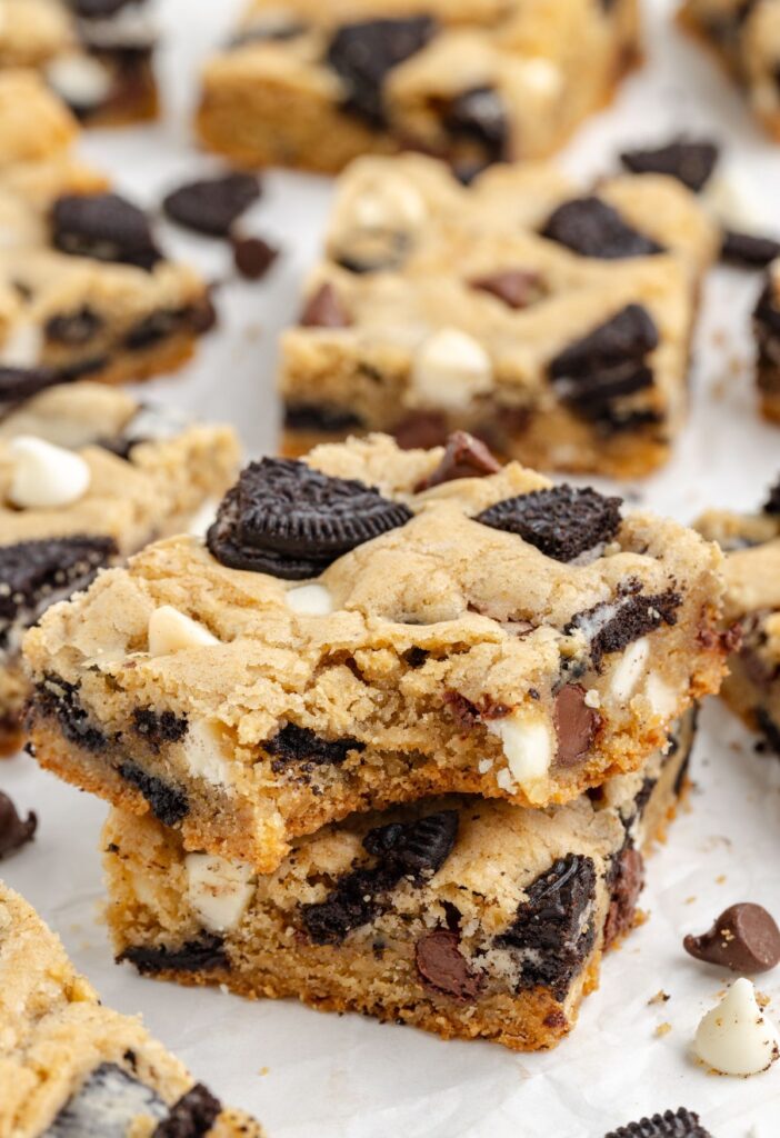 Cookie bars with a bite taken out of the corner of the top one.
