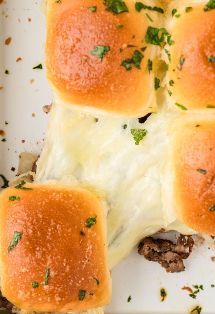 Cheese pull from the philly cheesesteak sliders